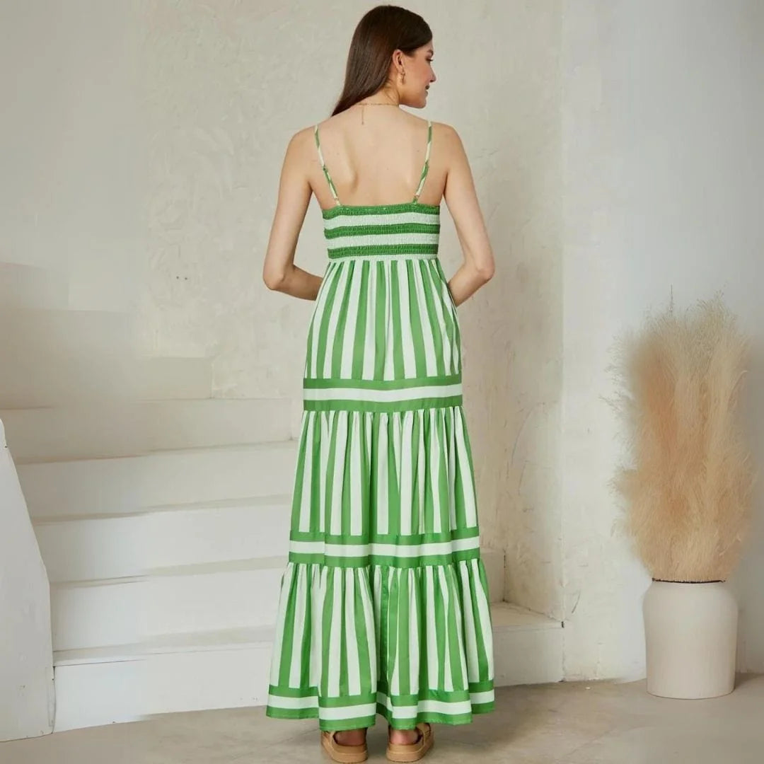 Tiered multi-color striped maxi dress with shoulder straps, perfect for a casual summer look.