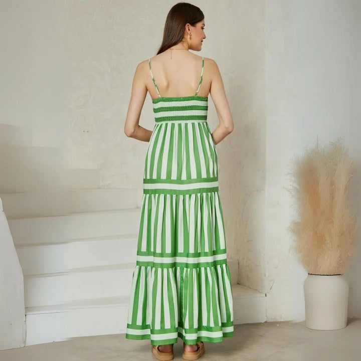 Tiered multi-color striped maxi dress with shoulder straps, perfect for a casual summer look.