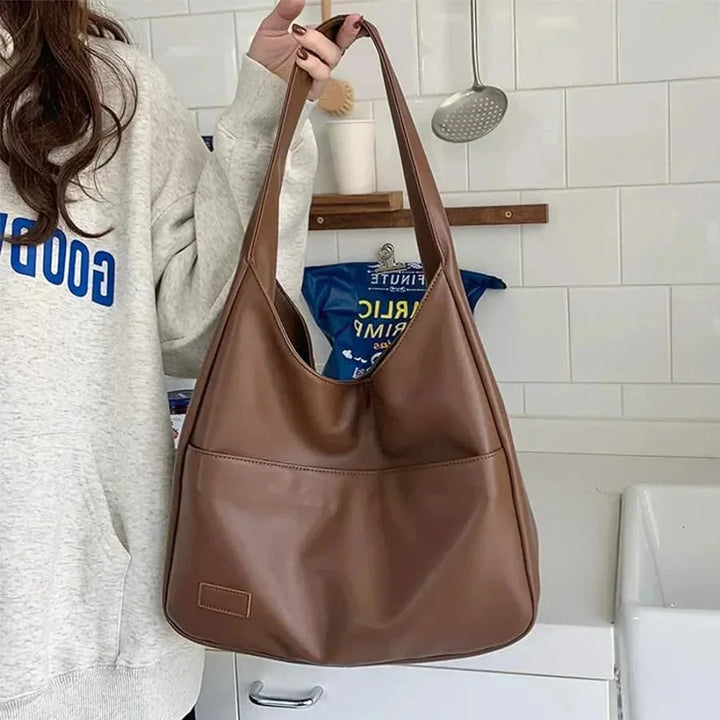 "Candy shoulder bag in sleek design with adjustable strap, crafted from durable vegan leather in black. Perfect accessory…