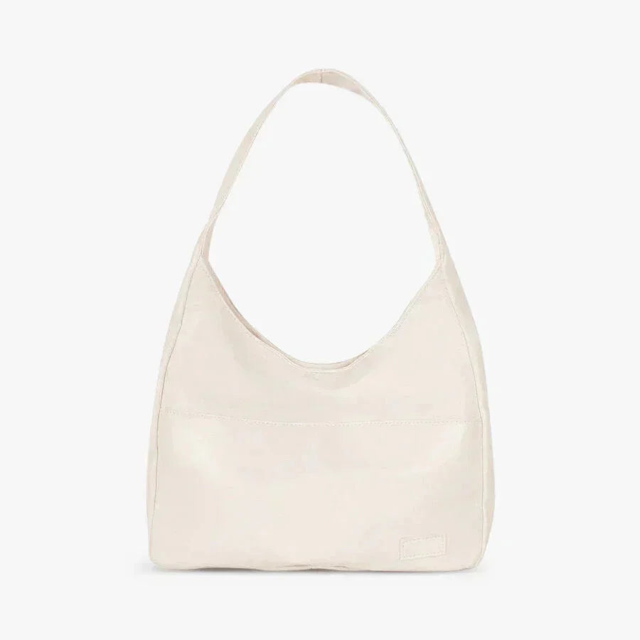 White Candy shoulder bag with sleek modern design, made of durable faux leather. Features adjustable strap, inner pockets,…