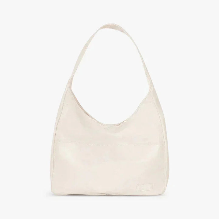 White Candy shoulder bag with sleek modern design, made of durable faux leather. Features adjustable strap, inner pockets,…