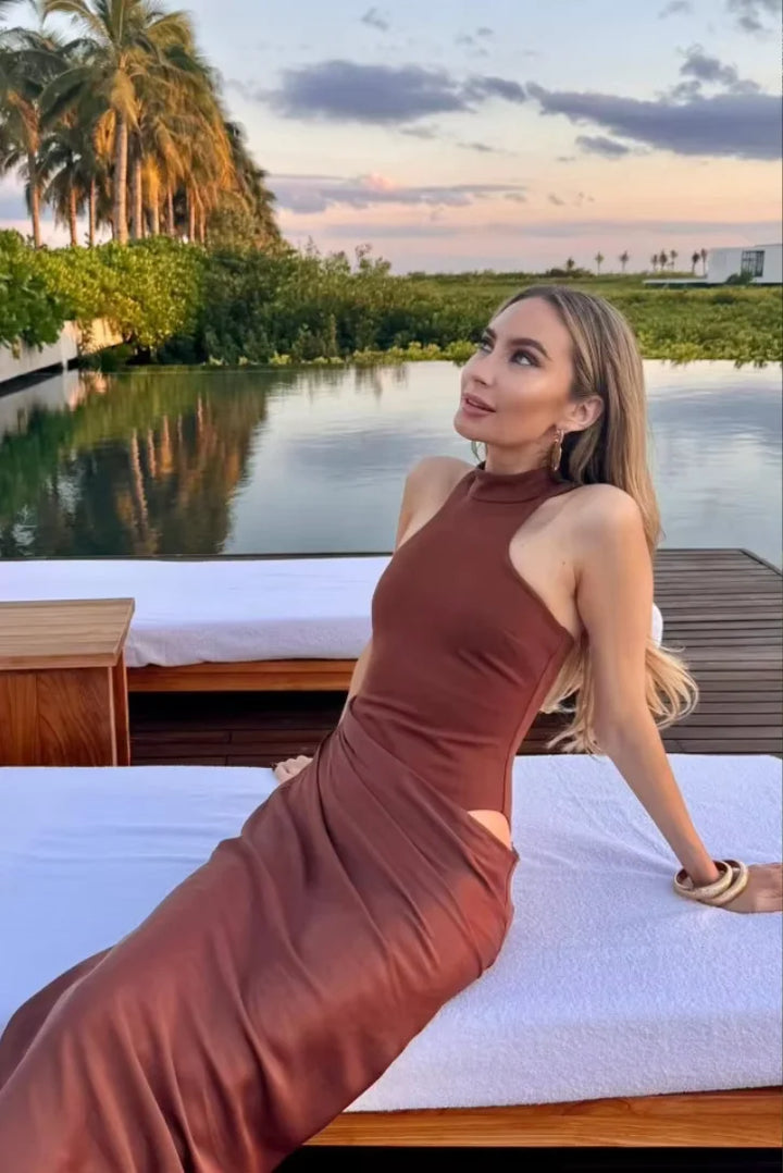 "Kenya halter neck maxi dress with cut-outs in lightweight and breathable fabric, perfect for casual or dressy occasions."
