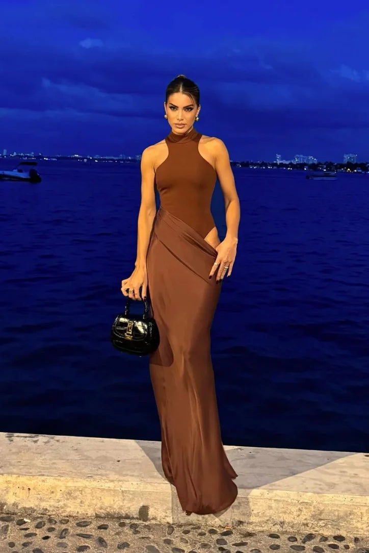 Halter neck maxi dress with cut-outs in soft polyester fabric, perfect for summer days and evening events.