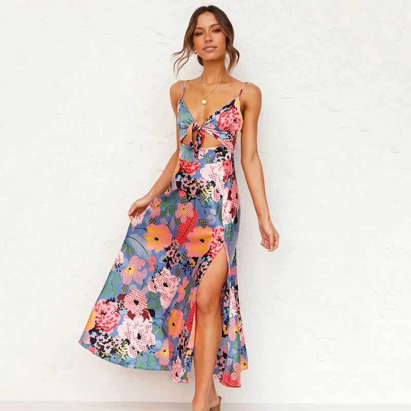 "Adina pink midi dress with floral print and cut-out front detail, perfect for a stylish day out."
