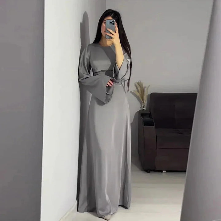 Gray floor-length dress with bell sleeves, offering a unique and elegant design perfect for formal occasions.