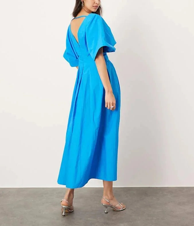"Justine vibrant blue dress with V-neck, kimono sleeves, and midi length. Soft and flowy material perfect for effortless…