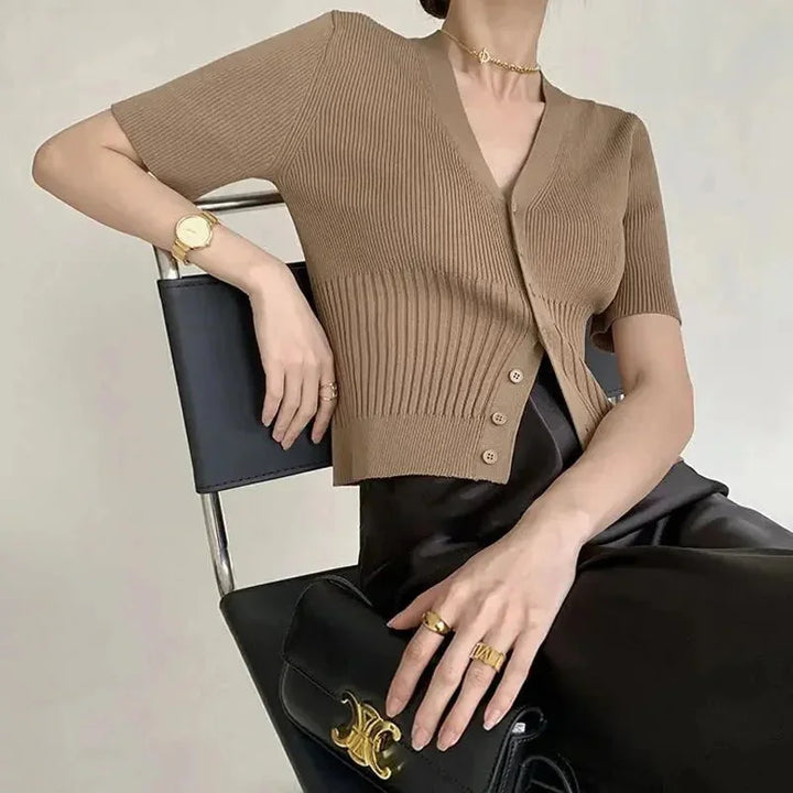 "Talitha knit cardigan in grey, fitted silhouette with button front, ribbed texture, long sleeves, and cozy high neckline."