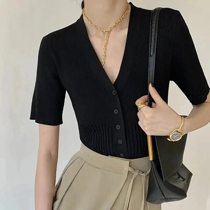 "Talitha fitted knit cardigan in gray with front buttons, ribbed detailing, and v-neck collar."
