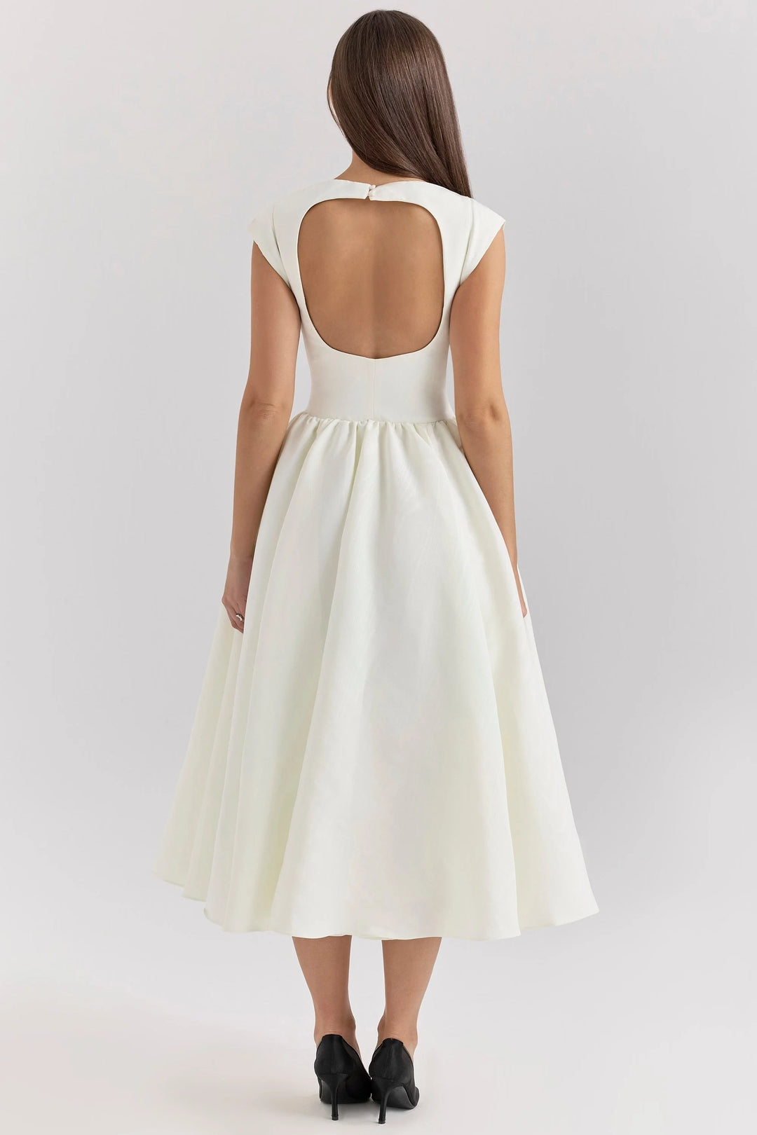 "Black sculpted bodice dress with mid-length hemline, perfect for formal events or evening gatherings."