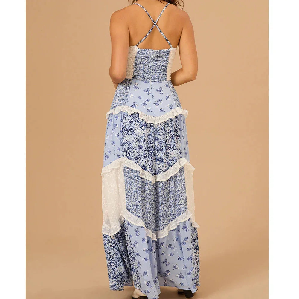 Women's tiered floral maxi dress in lightweight flowy fabric with vibrant floral print, perfect for a bohemian summer look.