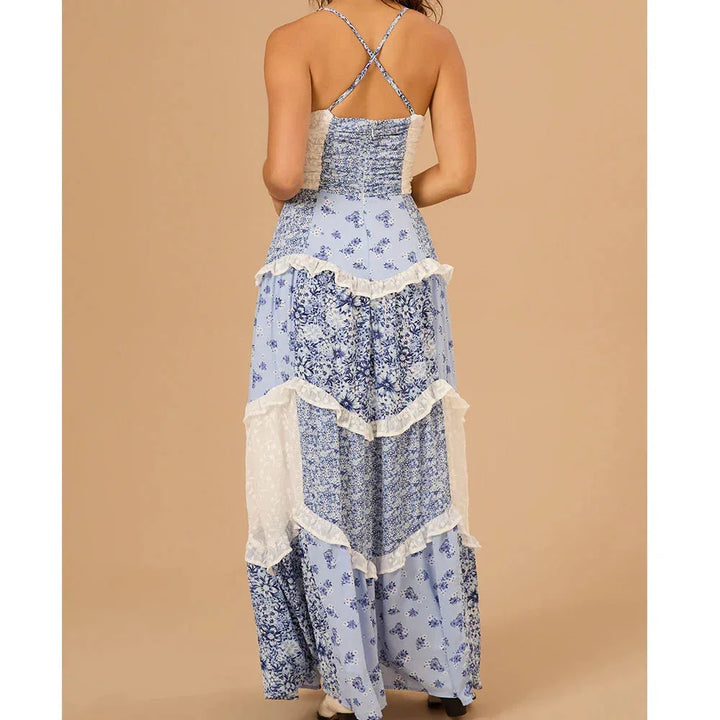 Women's tiered floral maxi dress in lightweight flowy fabric with vibrant floral print, perfect for a bohemian summer look.