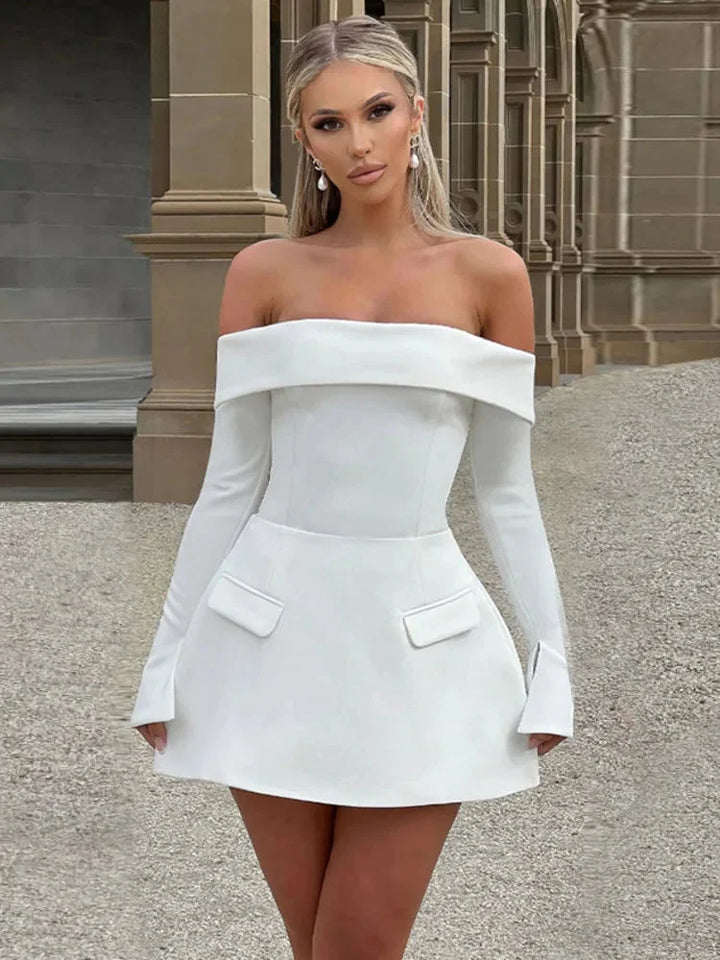 White off-shoulder skater dress in Avanna lace fabric with long sleeves, perfect for a feminine and elegant look.