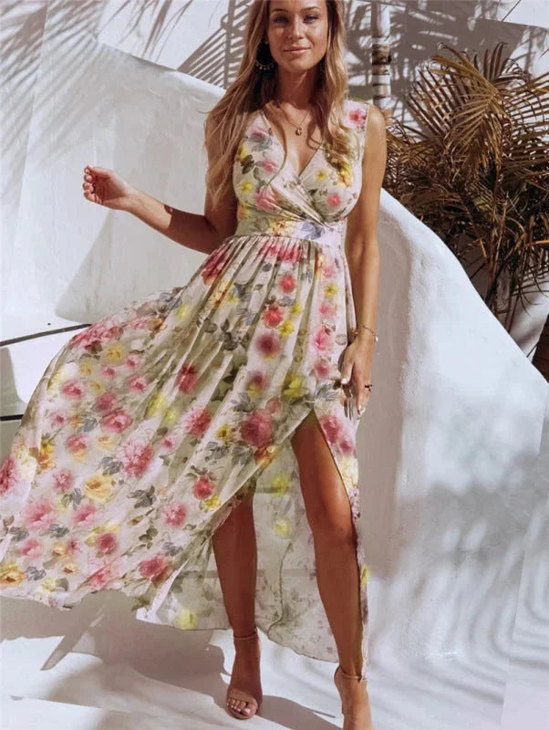 Yellow sleeveless maxi dress with split-front design, adorned with Avanna floral pattern. Ideal for summer in a…