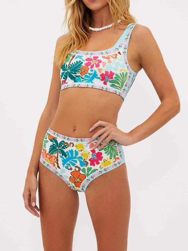 Floral high-waisted bikini set in Kathy design with vibrant colors and intricate floral print, ideal for a stylish beach look.