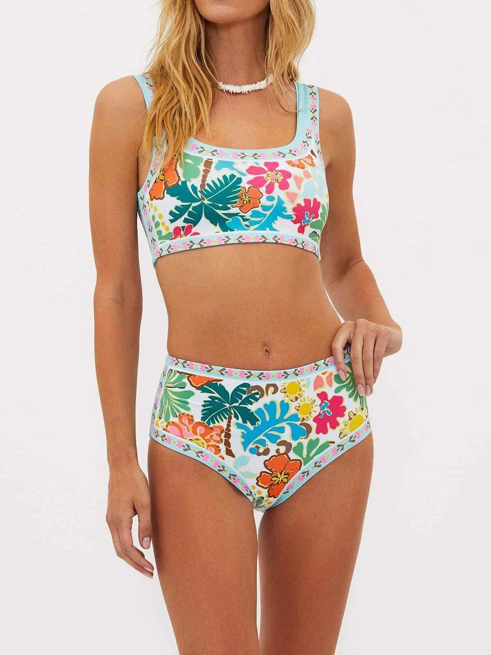 High-waisted bikini set in floral print, featuring a vintage-inspired design. Perfect for poolside lounging or beach outings.