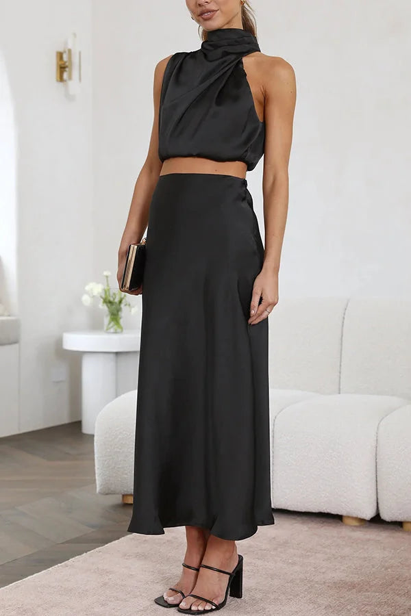 Black satin top and skirt set by Viola featuring a flowing design.