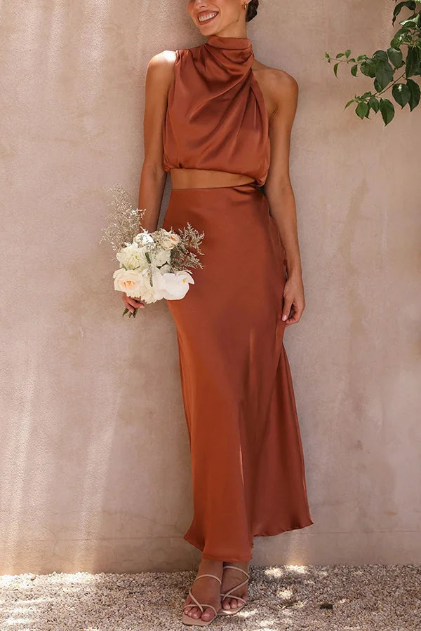 Brown satin skirt and top set by Viola featuring a flowing design.
