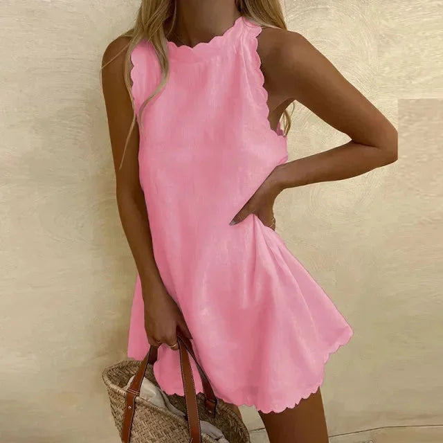 Pink sleeveless dress with scalloped hem. Made from soft cotton blend fabric. Features a chic and feminine design perfect…