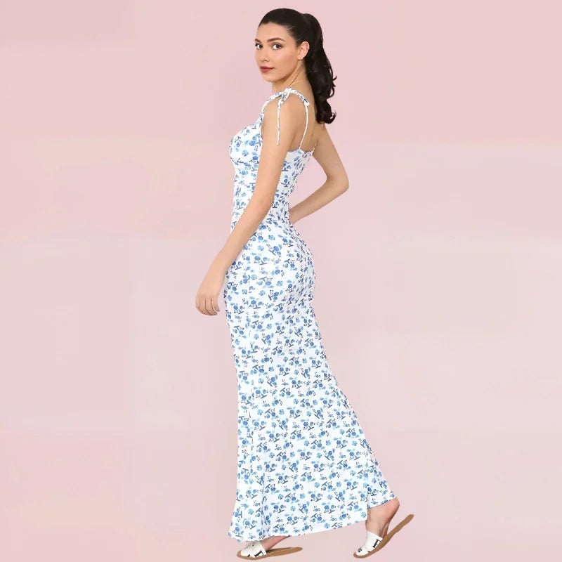 Sleeveless blue floral maxi dress with a lightweight, flowy fabric perfect for summer days. Floral pattern adds a touch of…