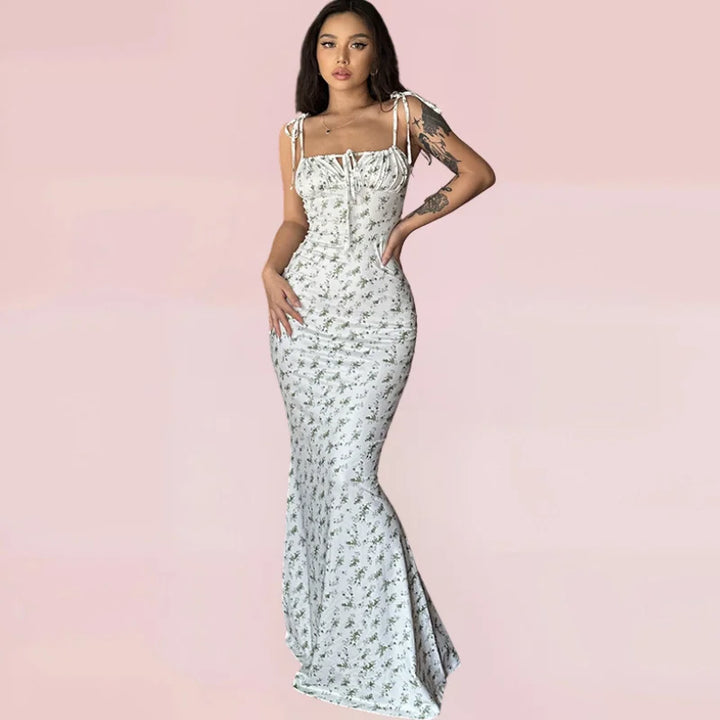 "Green sleeveless floral maxi dress featuring a flattering silhouette and flowy design, perfect for a casual yet stylish…