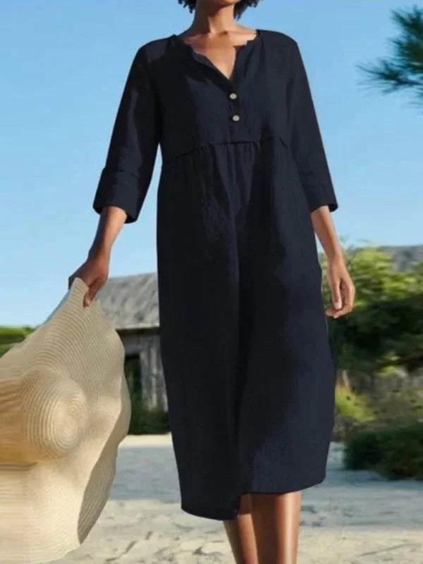 "Patricia V-neck midi dress in a versatile design made for comfort and style with convenient pockets."