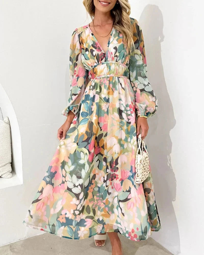 "Floral maxi dress with long sleeves, featuring a vibrant botanical print on soft flowing fabric, perfect for a…
