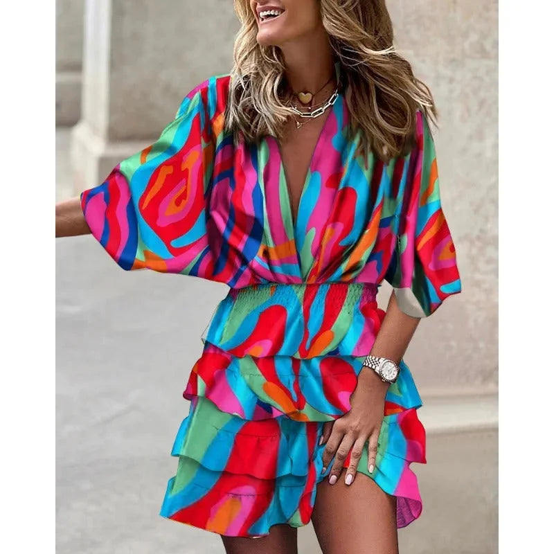 Aracely mini dress: Colorful tiered design, abstract pattern, perfect for sunny days.