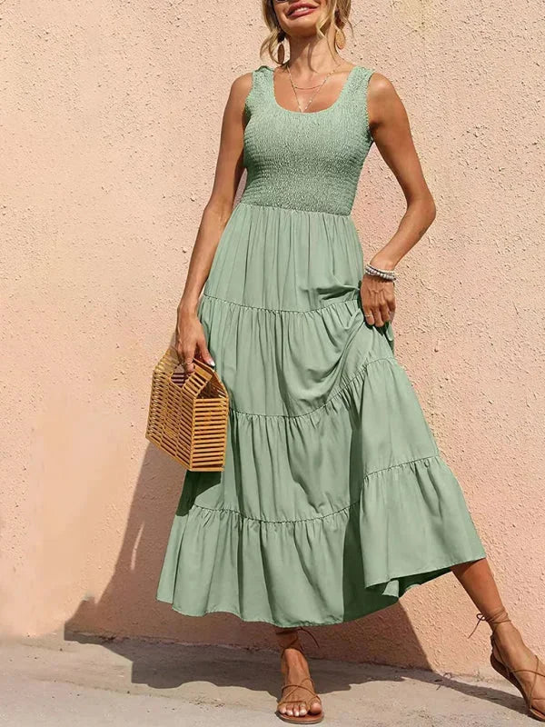 Sleeveless maxi dress with smocked bodice, made of breathable cotton blend, perfect for summer outings.