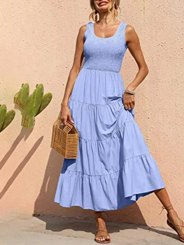 Light blue smocked bodice sleeveless maxi dress by Beaux - perfect for a breezy summer day. crafted with soft, flowing…