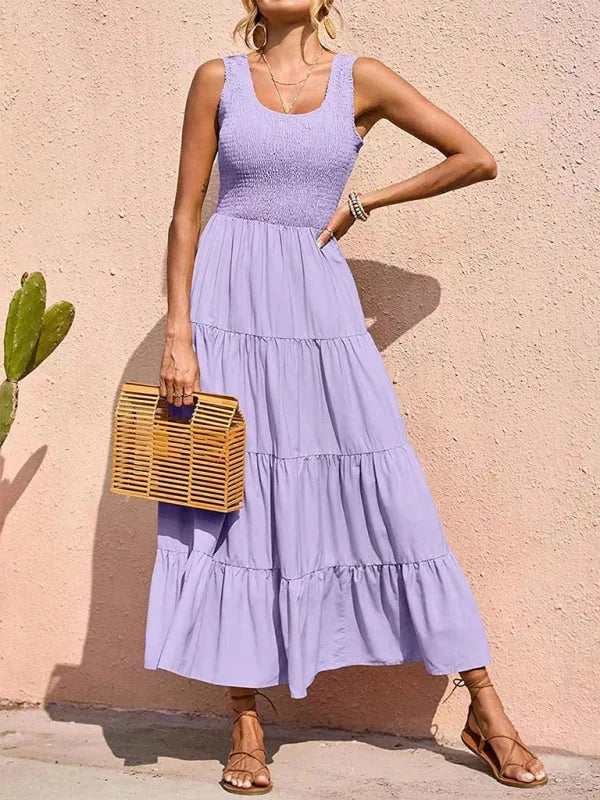 Purple sleeveless maxi dress with smocked bodice. Made of lightweight and breathable fabric. Perfect for casual summer…