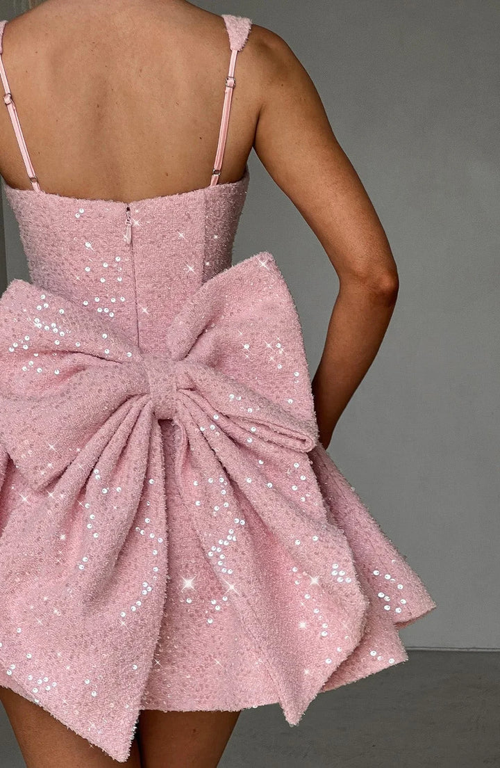 Abigale fit and flare mini dress in dazzling sequined fabric with a V-neckline and cap sleeves for a glamorous look.