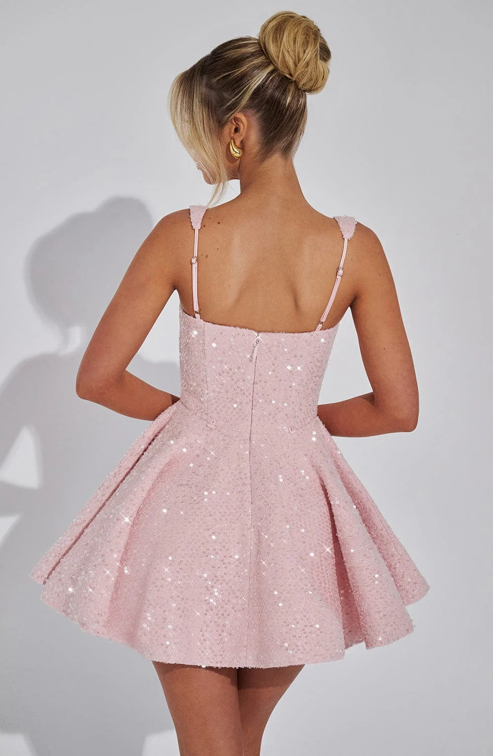 "Abigale fit and flare mini dress with sparkling metallic detailing, perfect for an elegant evening out."