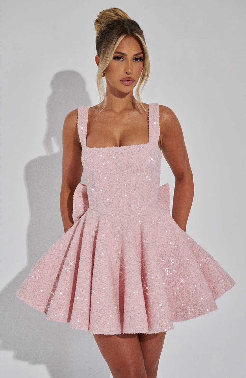 Abigale mini dress in sparkling fabric with fit and flare silhouette for a trendy chic look at your next event.
