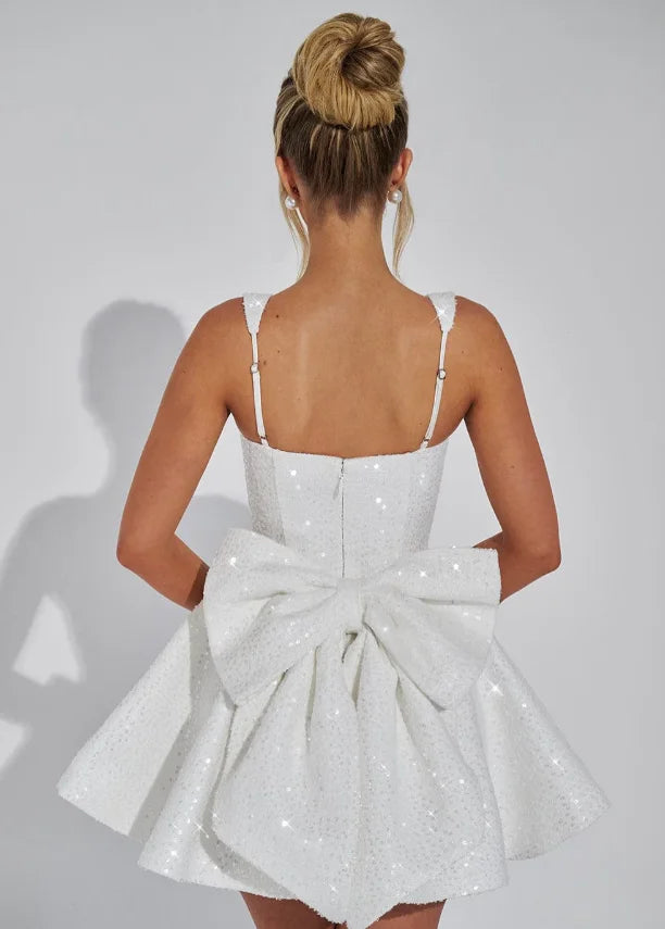 "Abigale mini dress in sparkling fit-and-flare design, made of shimmering fabric with intricate details, perfect for special…