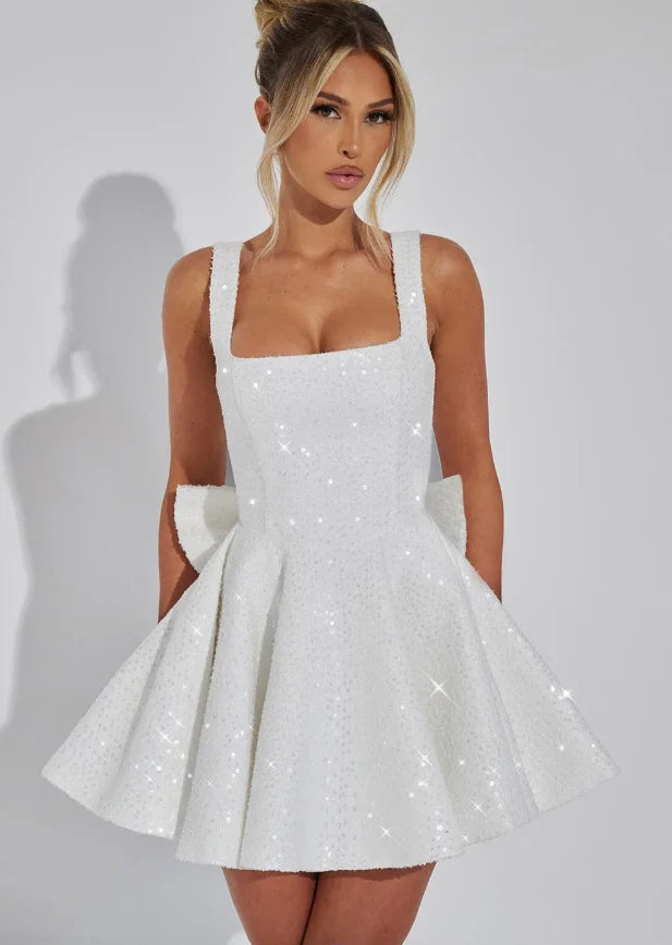 White fit and flare mini dress 'Abigale' featuring sparkling embellishments. Ideal for special occasions and crafted from…