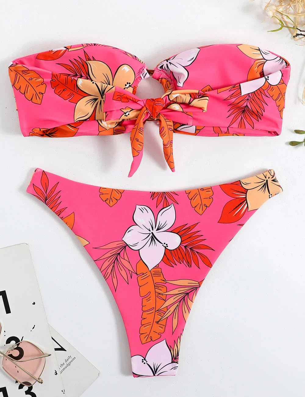 Pink strapless bikini with floral print, ring detail. Made from soft Imaan fabric. Ideal for sunny days by the water.