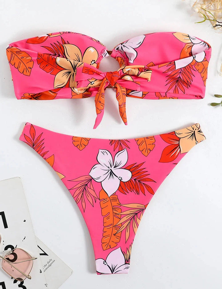 Pink strapless bikini with floral print, ring detail. Made from soft Imaan fabric. Ideal for sunny days by the water.