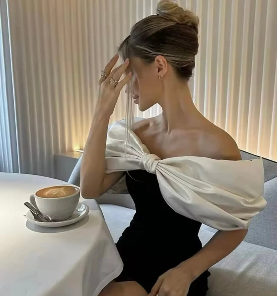 White off-shoulder dress with bow detail in soft flowing fabric - the True dress is effortlessly elegant and perfect for…