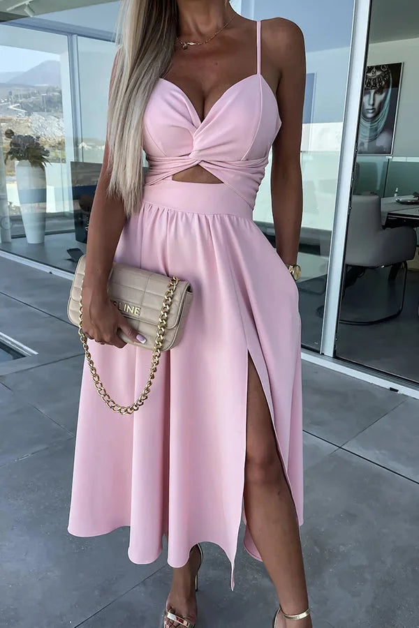 Pink midi dress with cut-out detail on the sides and convenient pockets. Comfortable and stylish for any occasion.