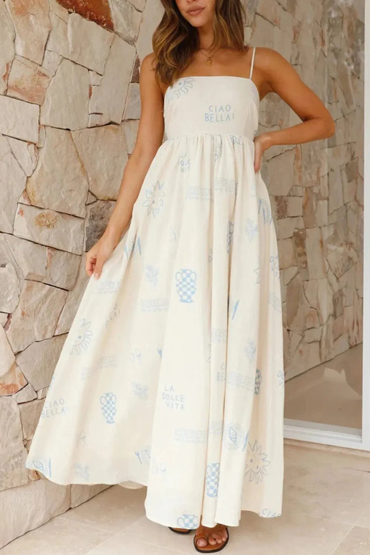 White maxi dress with floral print, spaghetti straps & flowy design. Ideal for summer, made with lightweight breathable…