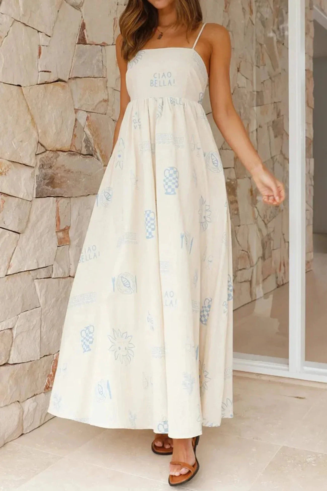 White maxi dress with spaghetti straps and artistic print design for women.