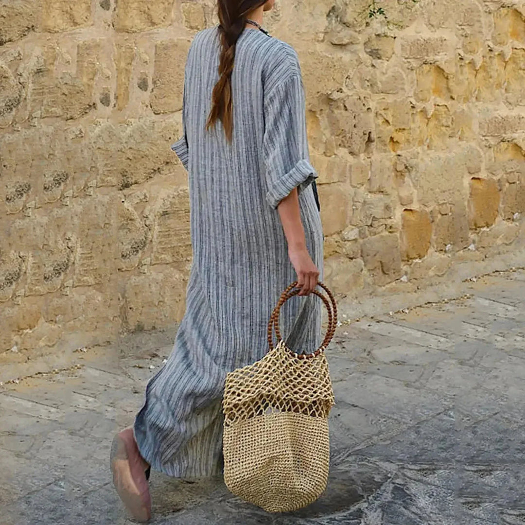 "Macy striped V-neck maxi dress in soft fabric, with convenient pockets and flattering design."