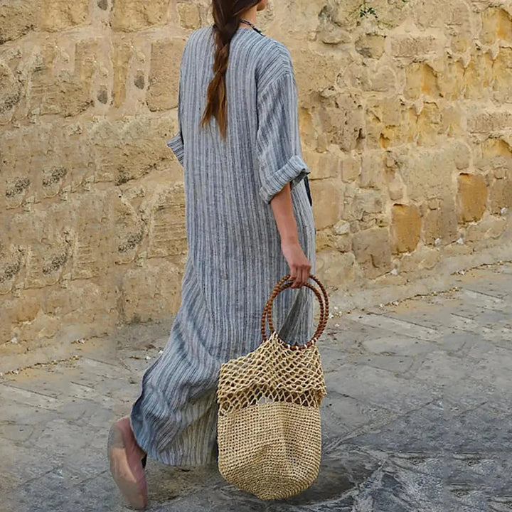 "Macy striped V-neck maxi dress in soft fabric, with convenient pockets and flattering design."