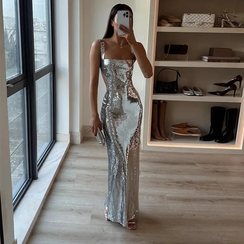 Stormy sequined floor-length dress with a V-neck, cap sleeves, and a flowing silhouette.