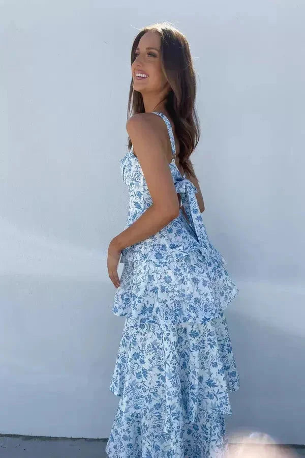 Stormy strapless dress with three-tier floral design, perfect for any occasion.