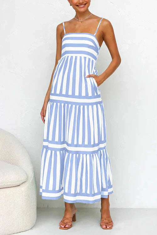 "Violet tiered maxi dress with strappy top, flowy design and lightweight fabric, perfect for a bohemian chic summer look."