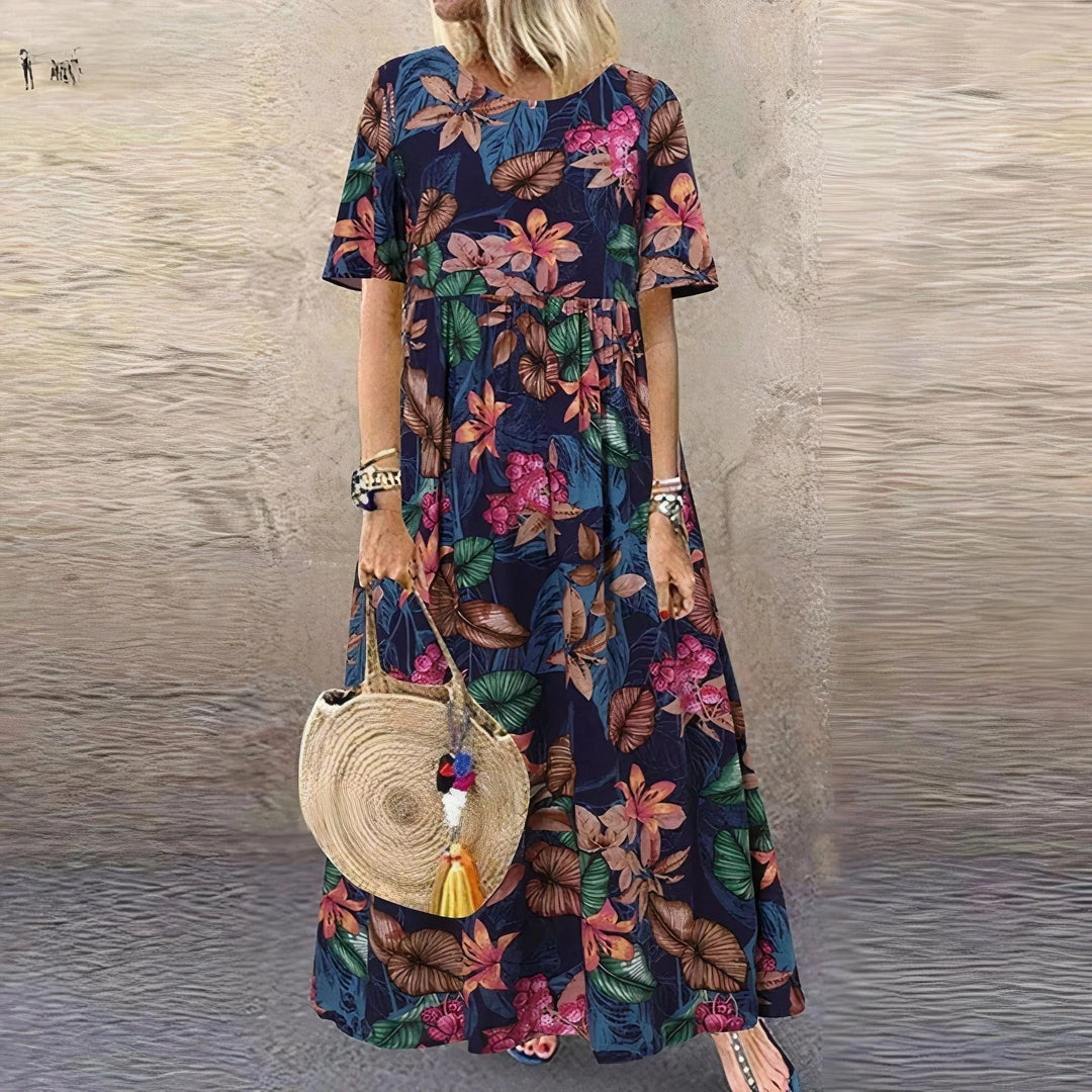 "Cimani tiered maxi dress featuring a charming botanical print, perfect for a stylish and feminine look in the spring."