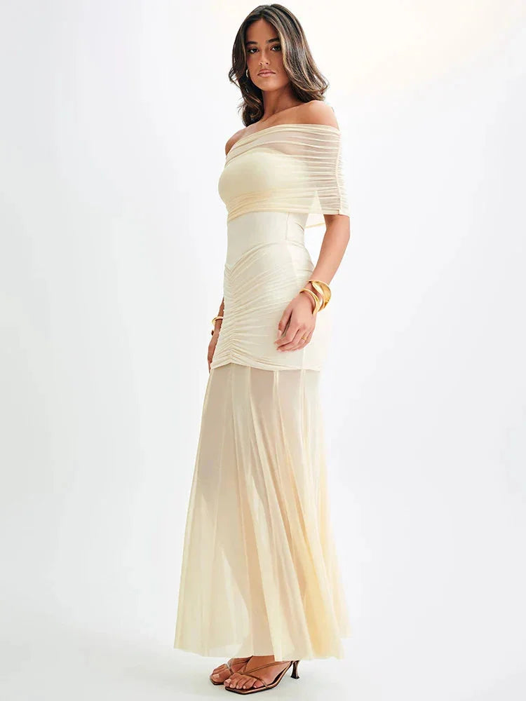 Off-shoulder maxi dress in Stefanie style, featuring a ruched bodice. Made of soft and flowy material, perfect for a breezy…
