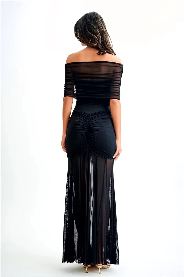 Off-shoulder maxi dress in Stefanie, featuring a ruched bodice and floor-length hem. Crafted from soft and stretchy fabric for…