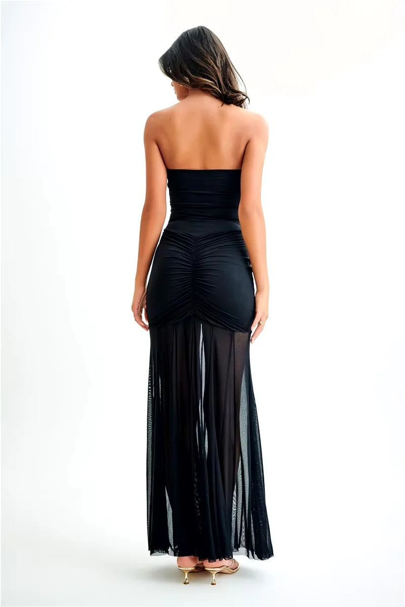 Off-shoulder maxi dress in Stefanie, featuring a beautifully ruched bodice and flowy skirt, perfect for a stylish summer look.